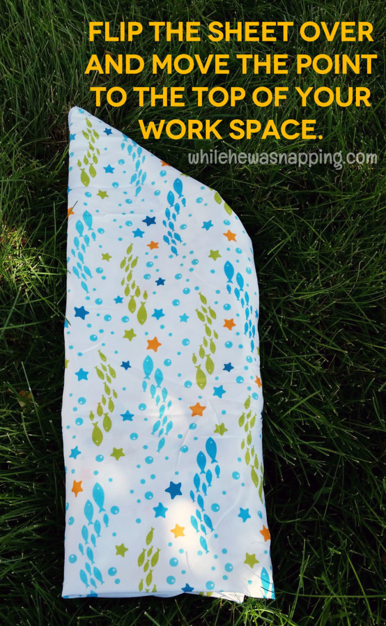 Folding a Fitted Sheet into a Roll While He Was Napping